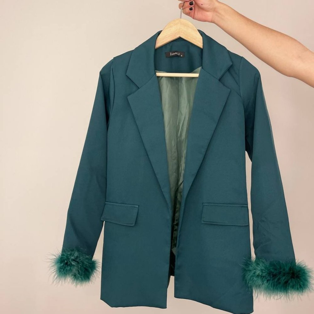 Green costume with feathers